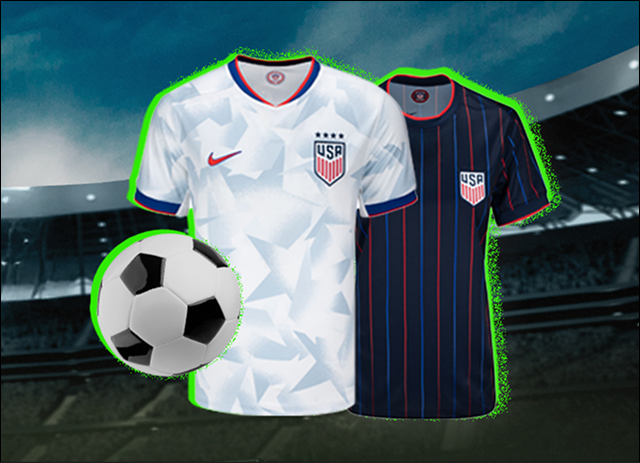 A soccer ball sits beside two U.S. soccer jerseys inside of a stadium.